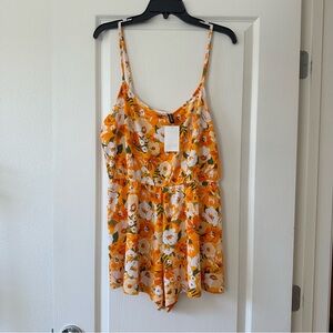 Orange floral romper size large nwt